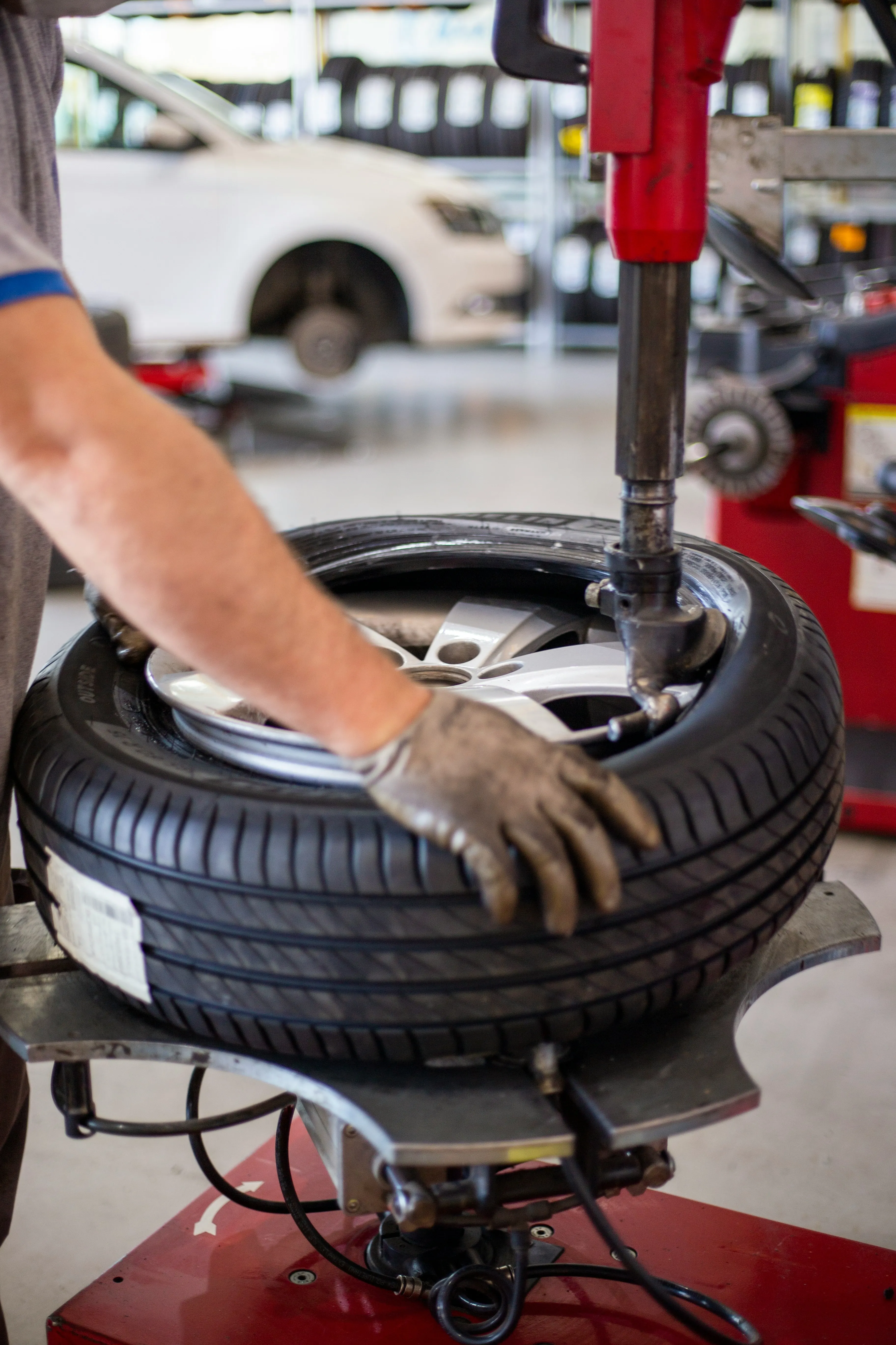 Technician performing tire repair service