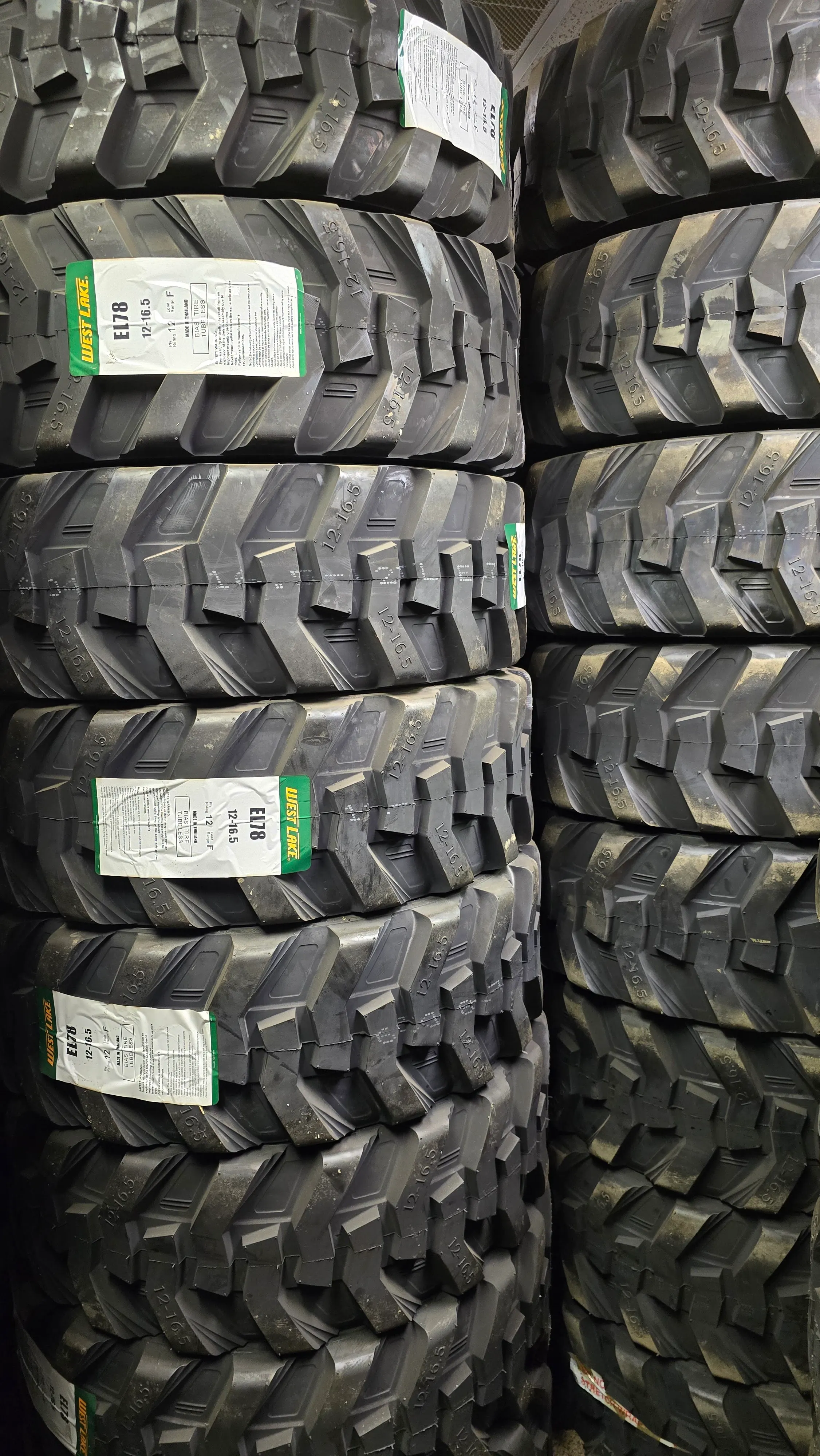 Skid steer tire and wheel assemblies for heavy-duty job-site use