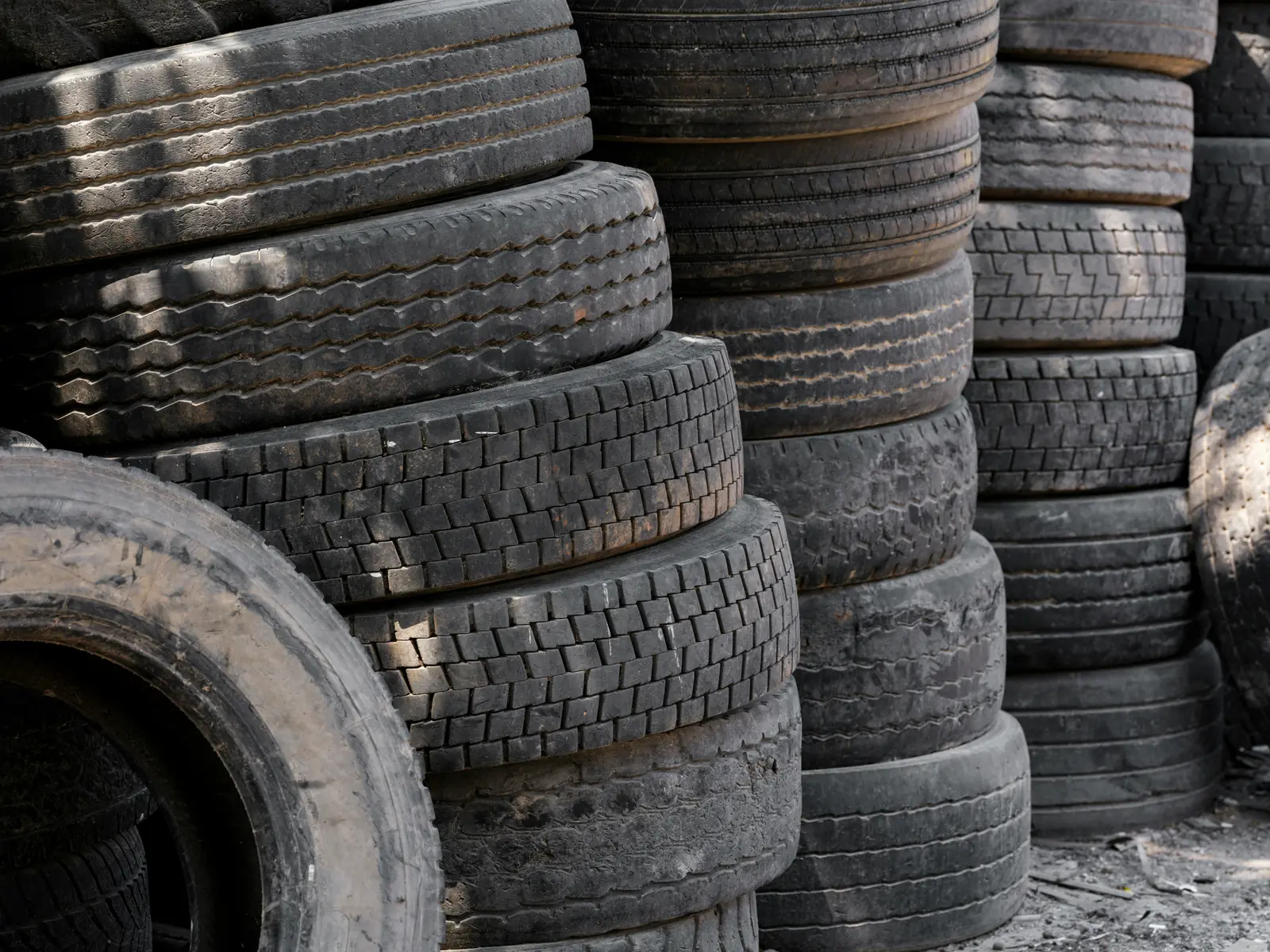 Pile of used passenger and light truck tires ready for recycling